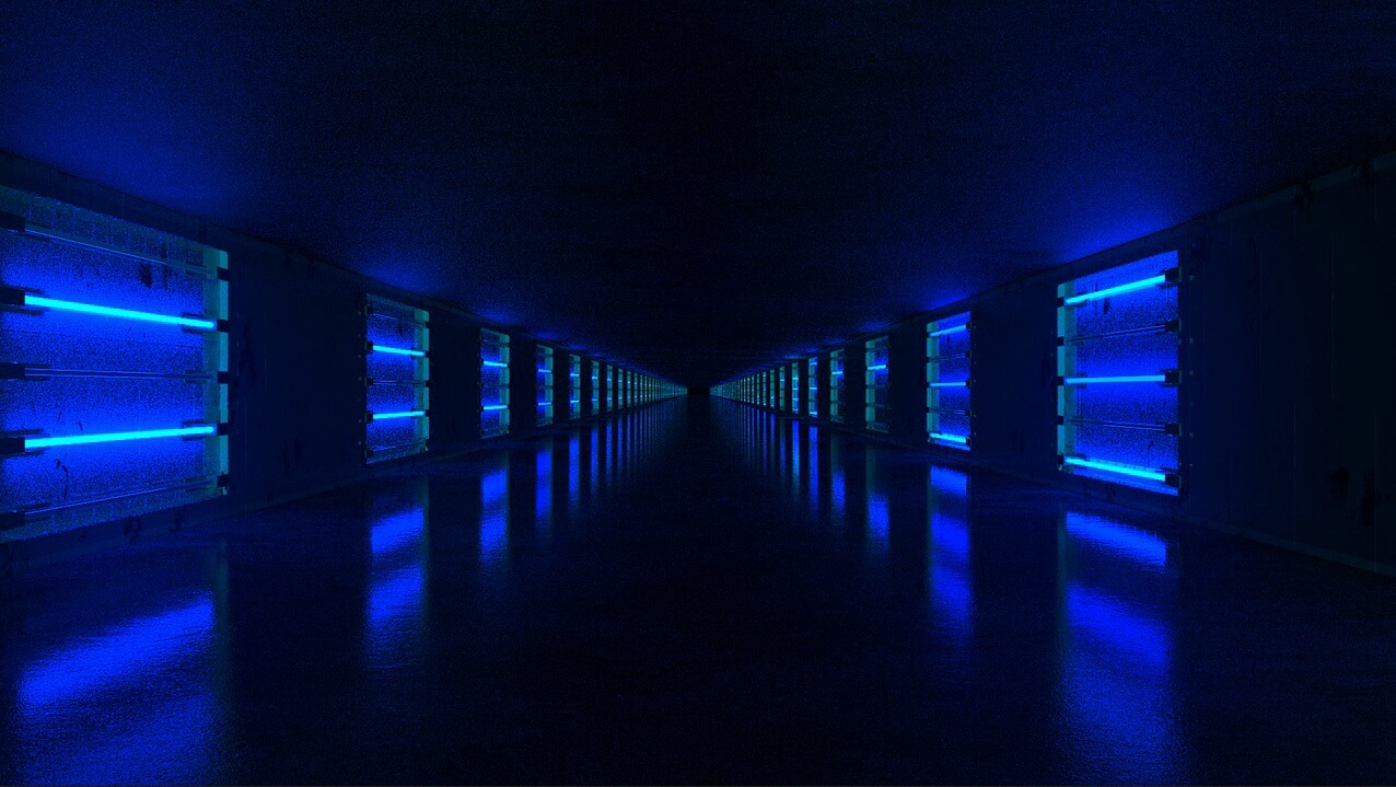 Imagem mostrando um túnel futurístico em luzes neon de cor azul usada para ilustrar que o governo precisa ajudar empreendedores que querem ser mais verdes